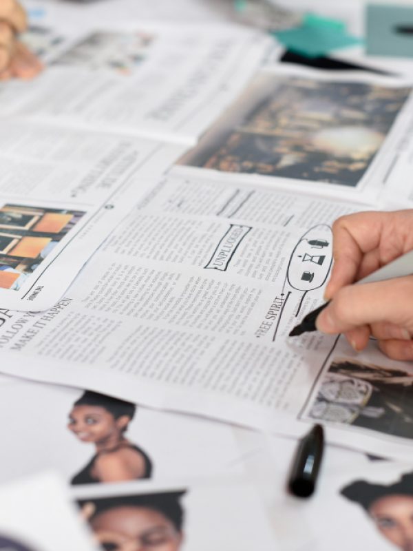 startup-business-people-working-checking-newspaper-information